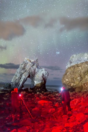 Aurora hunters Hreinn H jartarson and his brother Gaukur, on a beach near HúsavÃk in northern Iceland.