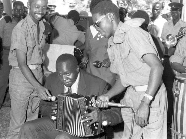 Idi Amin playing the accordion at Buvuma Island in 1971.