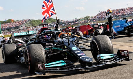 Mercedes’ Lewis Hamilton celebrates in parc ferme after winning the British Grand Prix at Silverstone.