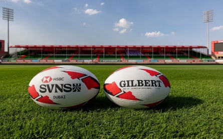 Two rugby balls side by side