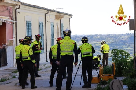 Firefighters in a rescue operation in Sicily