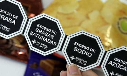 Black hexagonal labels on bags.