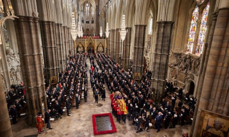 The Queen’s coffin is carried out of Westminster Abbey after the church ceremony at the Abbey