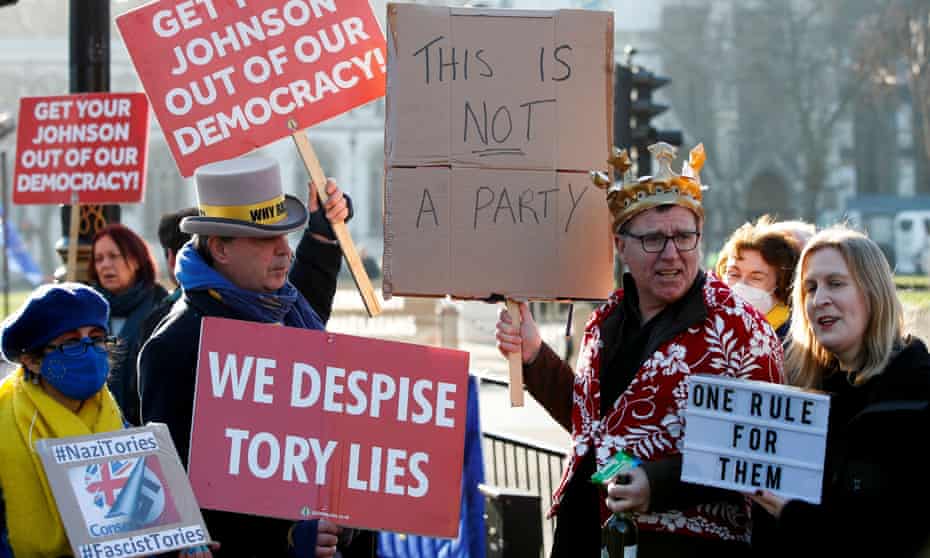 protesters with anti-Tory posters