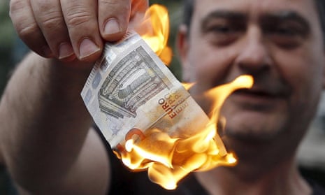 a protestor burns a euro note in athens in june 2015