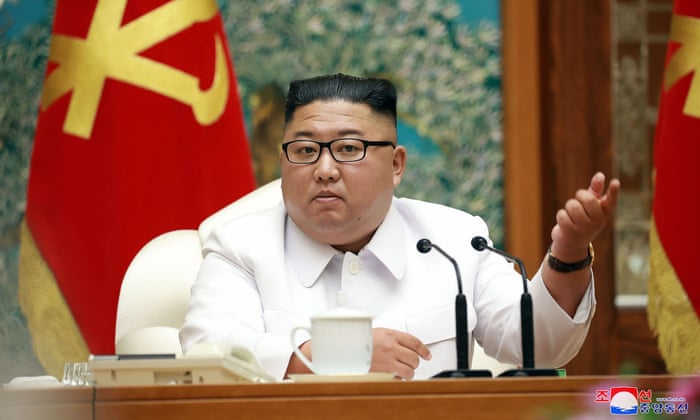 This picture taken on 25 July 2020 and released from North Korea’s official Korean Central News Agency (KCNA) on 26 July shows North Korean leader Kim Jong Un attending an emergency enlarged meeting of Political Bureau of WPK Central Committee at an undisclosed location.
