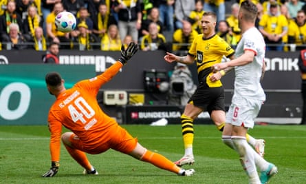 Marco Reus scores for Borussia Dortmund during their one-sided victory