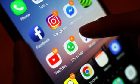 Various social media apps on a smartphone's home screen