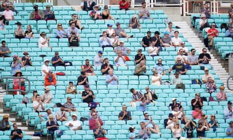 Spectators observing social distancing in the stands during a friendly match at the Oval, London in August.