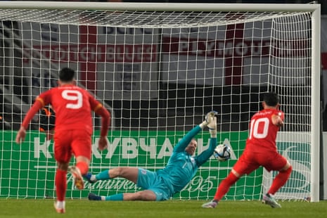 England's goalkeeper Jordan Pickford saves a penalty from North Macedonia's Enis Bardhi only for him to score the rebound.