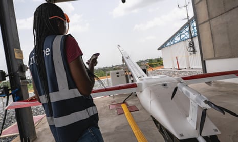A worker prepares a Zipline medical delivery drone