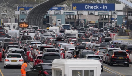 Heavy traffic congestion at the Port of Dover with multiple lanes of vehicles queuing towards frontier control booths