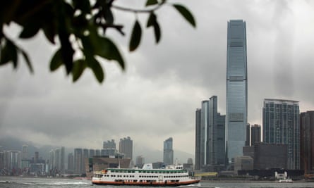 A ferry in Victoria harbour passes the International Commerce Centre building in Hong Kong.