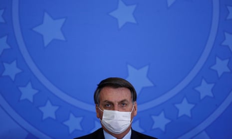 Brazil’s President Jair Bolsonaro looks on during an inauguration ceremony of the new Communications Minister Fabio Faria (not pictured) at the Planalto Palace, in Brasilia<br>Brazil’s President Jair Bolsonaro wearing a protective face mask looks on during an inauguration ceremony of the new Communications Minister Fabio Faria (not pictured) at the Planalto Palace, in Brasilia, Brazil June 17, 2020. REUTERS/Adriano Machado