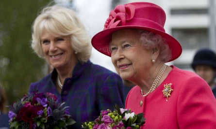 Queen Elizabeth II and the then Duchess of Cornwall during a visit to a riding centre in Brixton in 2013