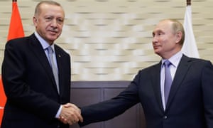 Recep Tayyip Erdoğan (left) is greeted by Vladimir Putin before their meeting in Sochi, Russia
