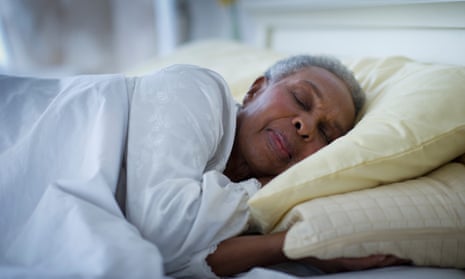 Black woman sleeping in bedGettyImages-123317988
