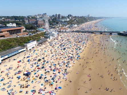 Visitors enjoys the hot weather at Bournemouth beach in late May.