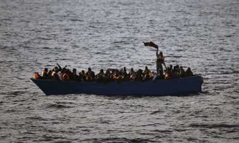 Migrants wave for help from a wooden boat 21 miles north of the Libyan coast. European countries have shown little appetite for drawing up a united strategy.