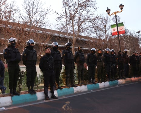 Members of the Iranian police stand guard at a protest in Tehran, Iran.