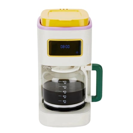 White plastic coffee maker with digital display and yellow, pink and green details
