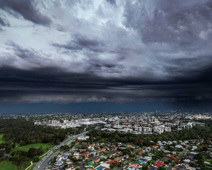 Brisbane storms and hail leave nearly 100,000 without power as trees downed and roofs stripped