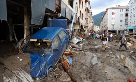 Residents of Bozkurt on Turkey’s Black Sea coast survey the damage caused by devastating flooding.