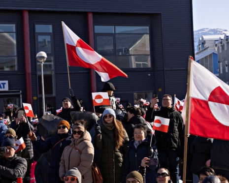 People protest under the slogan, "Greenland belongs to the Greenlandic people", in Nuuk last year.