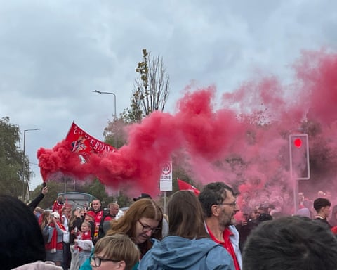 Red flares lit as fans await the champions.