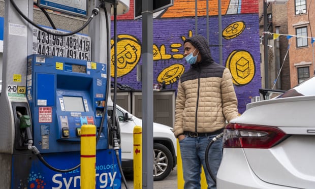 A driver fills up a vehicle's gas tank at a Mobil gas station in New York City on 14 November 2021.