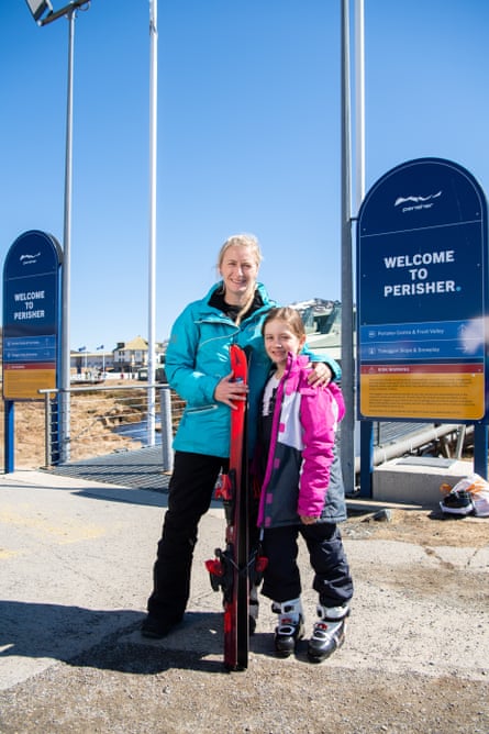 Carley Aherns and daughter Skylah at the entrance to Perisher Blue Ski Resort, NSW.