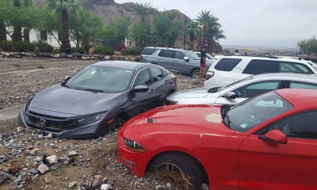 In this photo provided by the National Park Service, cars are stuck in mud and debris from flash flooding at The Inn at Death Valley in Death Valley National Park, Calif., Friday, Aug. 5, 2022. Heavy rainfall triggered flash flooding that closed several roads in Death Valley National Park on Friday near the California-Nevada line. The National Weather Service reported that all park roads had been closed after 1 to 2 inches of rain fell in a short amount of time. (National Park Service via AP)