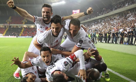 Besiktas’s players celebrate winning the Super Lig championship in May 2017