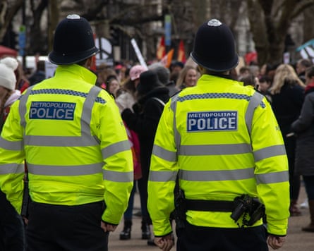 Two police officers in uniform.