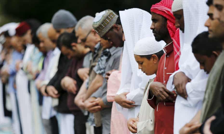 Muslims pray for Eid-al Fitr at a park in London