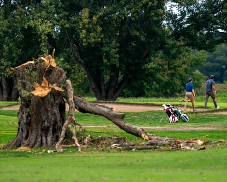 Golfers play on the East Potomac golf links course after The National Park Service removed hundreds of trees over the weekend in Washington, DC.