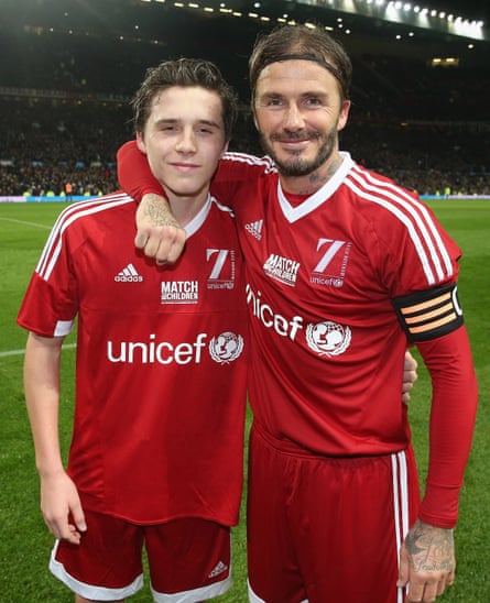 Brooklyn and David Beckham during a charity match, Old Trafford, Manchester, 14 November 2015.