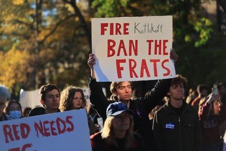 Students protest holding signs.
