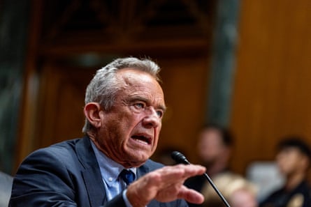 a men speaking in front of a microphone