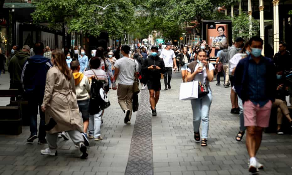 Shoppers walk in Pitt Street Mall in Sydney