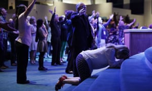 Worshippers pray at the International Church of Las Vegas before the arrival of Donald Trump during a campaign event in 2016.