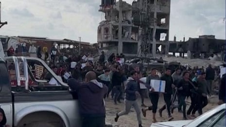 Chaotic scenes during aid distribution in Gaza City as residents flee gunfire – video