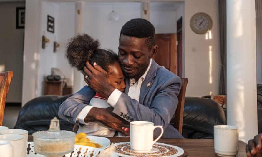 Ugandan presidential challenger Bobi Wine and his daughter Subi at his home in Kampala.