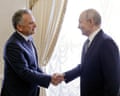 Steve Witkoff and Vladimir Putin shake hands.