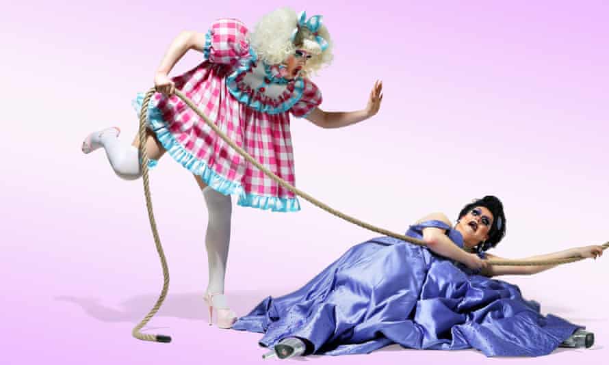 Lawrence Chaney (in purple) and Ellie Diamond (in pink), RuPaul’s Drag Race Drag Queens, dressed up against a white background, 01/03/2021