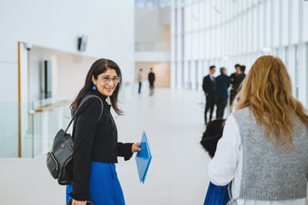 Two women in a light and airy building.