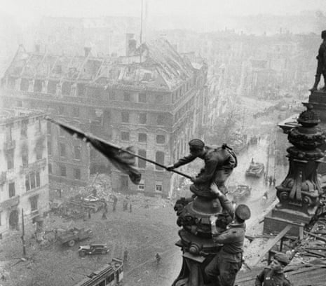 Yevgeny Khaldei’s original image of the Soviet flag being raised over the Reichstag, Berlin, 1945, above, was later amended to obscure the officer wearing a watch on both wrists.