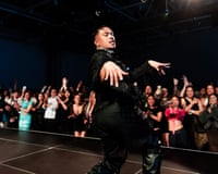 A performer posing on a catwalk