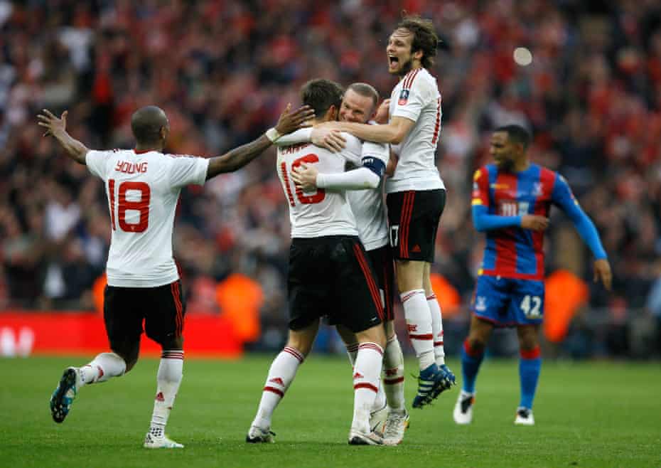 United players celebrate after the final whistle goes.