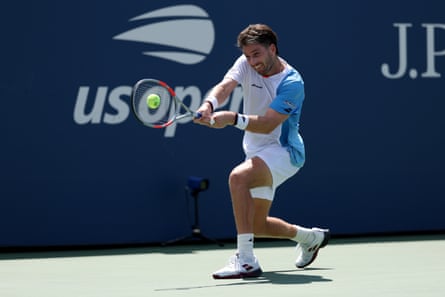Cameron Norrie returns a shot against Sebastian Korda before the American retired after two sets with back trouble